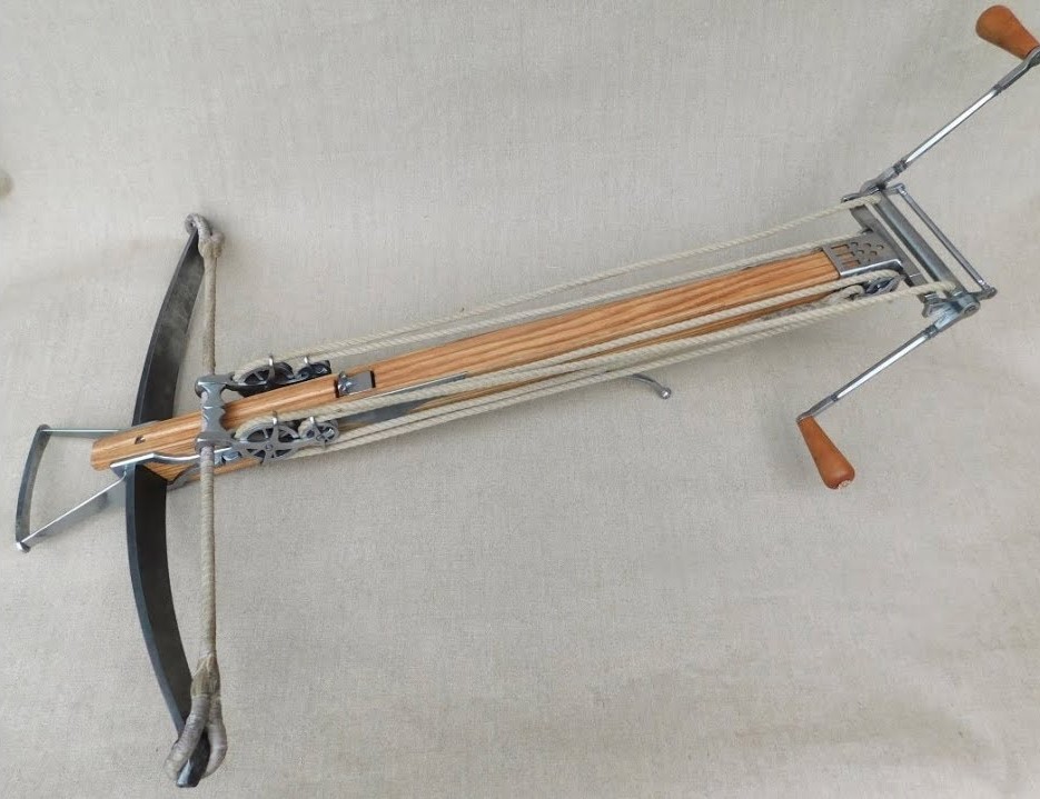 It's a crossbow that needs to be cranked in order to reload. Packs a punch too!