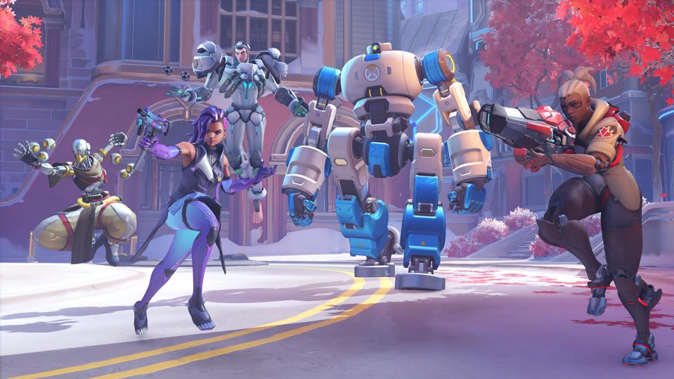 A team of Overwatch heroes escorting the payload in a brand new game mode.