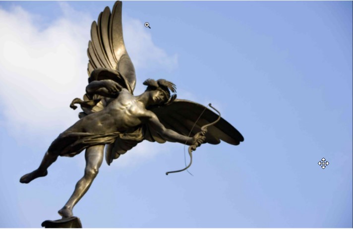 A picture of a bronze Eros statue, he has wings and is holding a bow and arrow.
