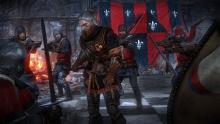 Geralt surrounded by enemies. He can deal with all of them if he really wants to.