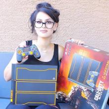 Unboxing the Call of Duty: Black Ops III-themed PS4. (from https://www.facebook.com/SSSniperWolf/photos/a.410430455744903.1073741829.388887381232544/856696814451596/?type=3&theater)