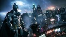 Batman watching over Gotham City in Batman: Arkham Knight