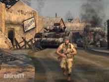 A snapshot from the first ever Call of Duty game, a war scene featuring tanks and barricades. 