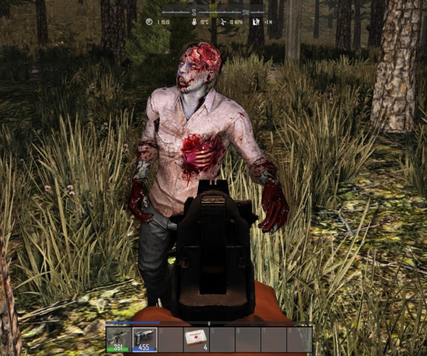 Hungry zombie at the barrel of a gun 