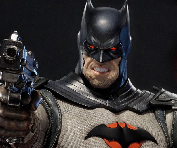 Batman holding a gun