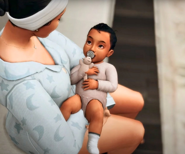 A heartwarming Sims 4 image of a mother cradling her newborn baby.