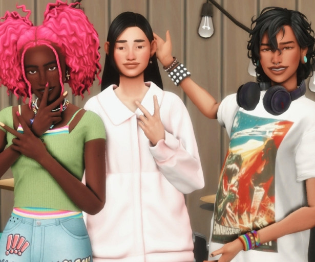 A fun image from The Sims 4 shows three friends goofing around and taking selfies using playful poses.